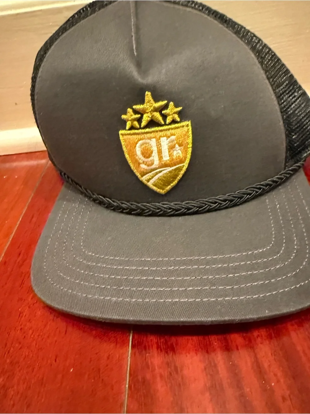 Gray Trucker Hat with Gold Shield Patch